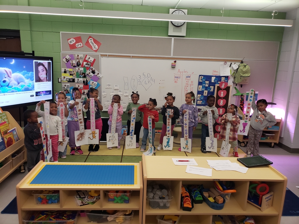 Students showing Apple Crunch project to guests.