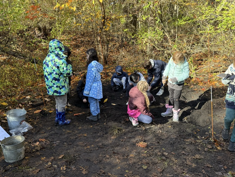 Kids digging in the archeological site.