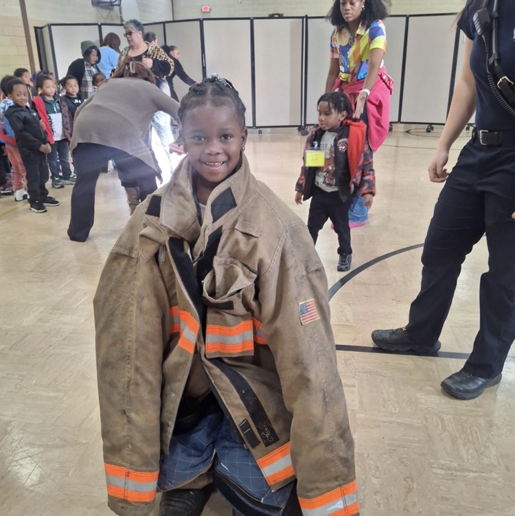Claytor Head Start children enjoyed trying on fire fighter gear!