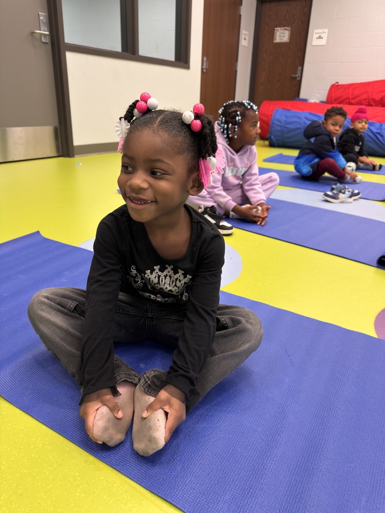 Students doing yoga. 