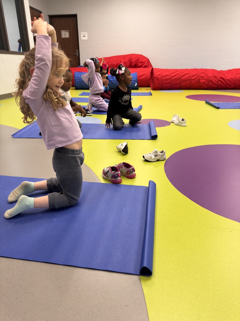 Students doing yoga. 