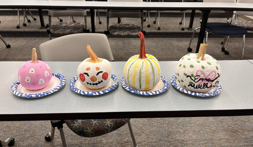 four pumpkins that event attendees painted