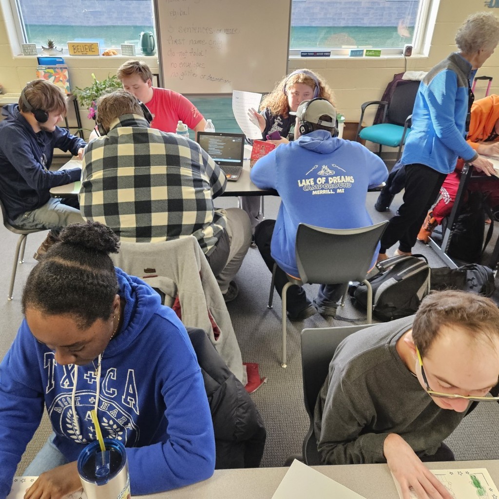 intently writing letters