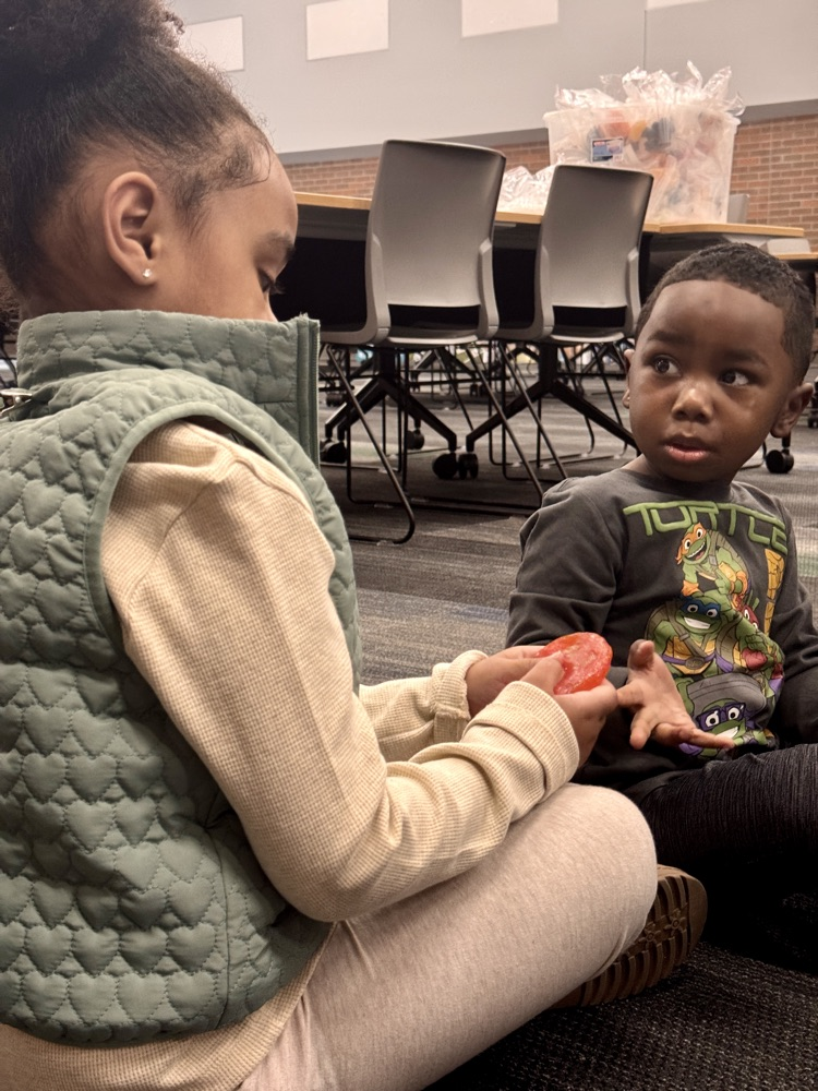 students exploring different foods. 