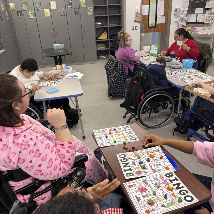 classroom of adult special needs students playing valentine picture bingo