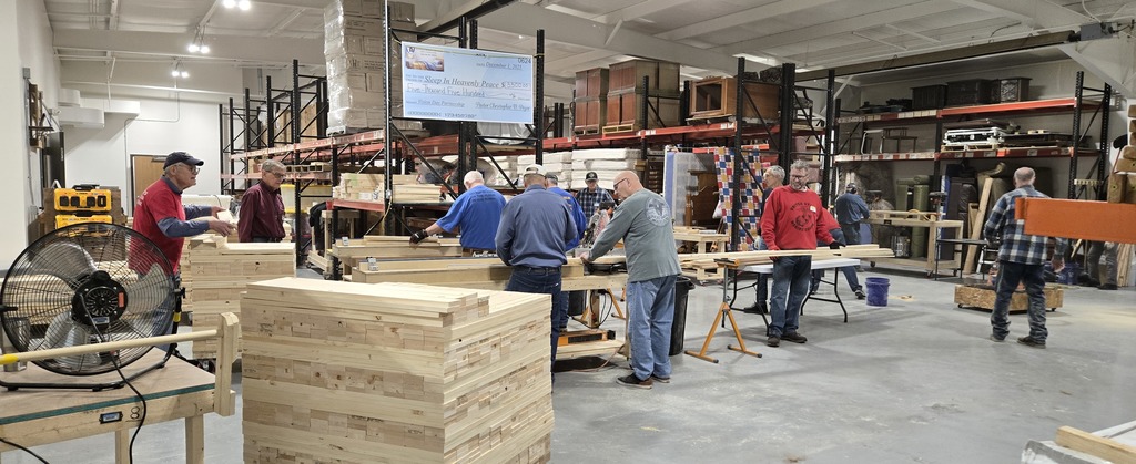 Volunteers working on cutting wood