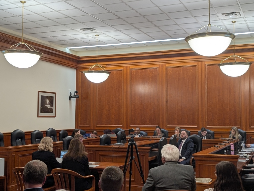 Picture shows Chris Bolen and Kelly Kujala sitting at desk in front of House Committee on Ed and Workforce during testimony.
