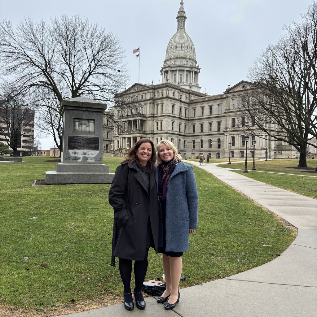Chris Bolen and Kelly Kujala in front of the Michigan State Capitol Building.