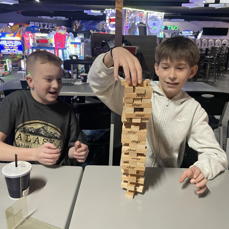 two boys playing jenga