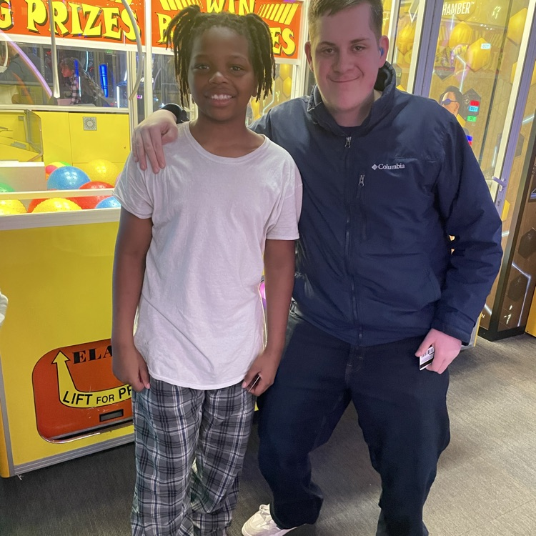 two teenaged boys smiling