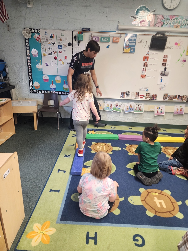 Strengthening our gross motor skills with a walk on the balance beam.