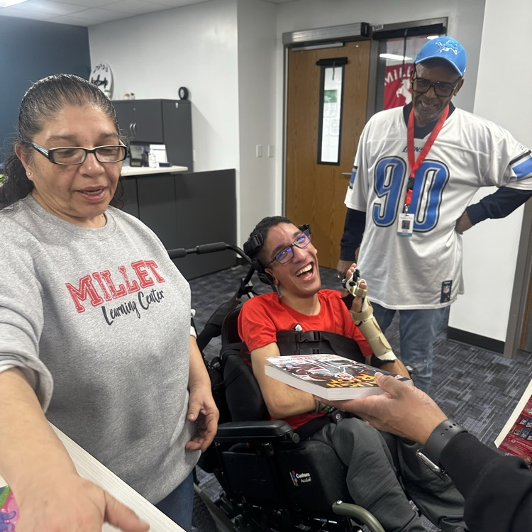 students getting a book from the book fair.