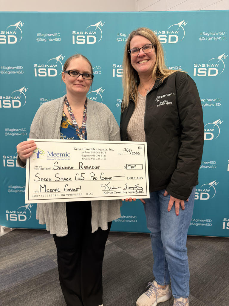 Ms. Rabadue accepting check from Meemic. 