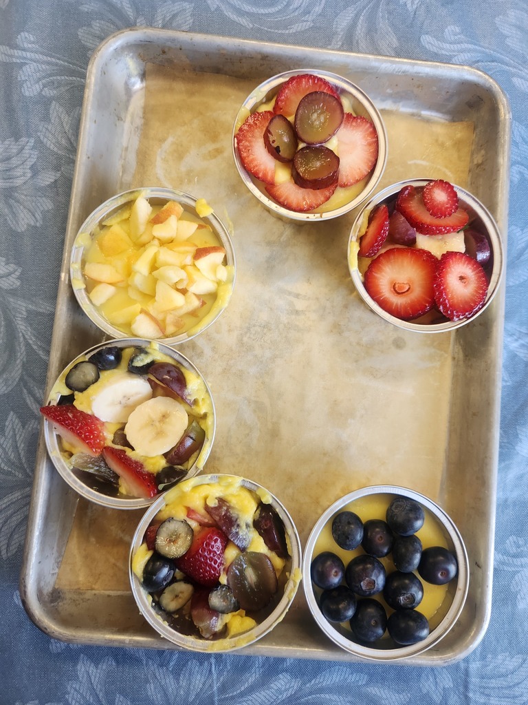 pretty fruit tarts on  a tray