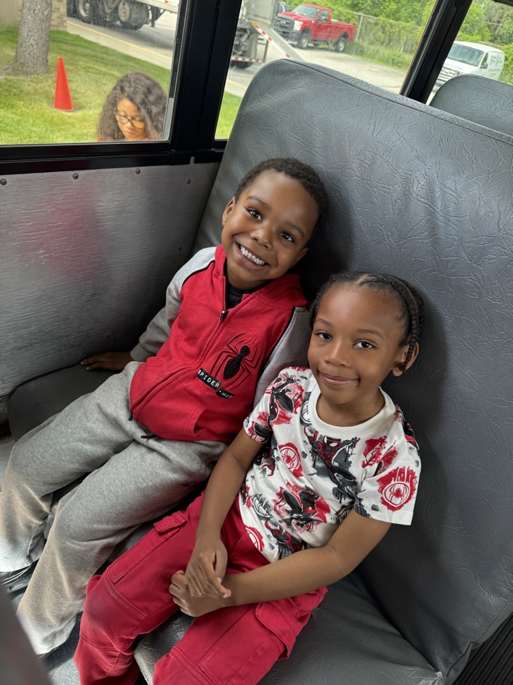 two children sitting in the bus