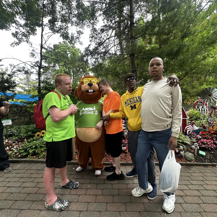 students clean zoo