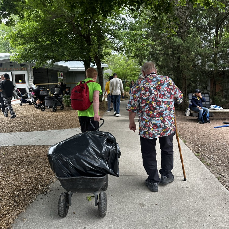 students clean zoo
