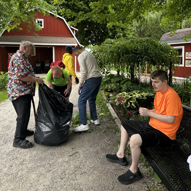 students clean zoo