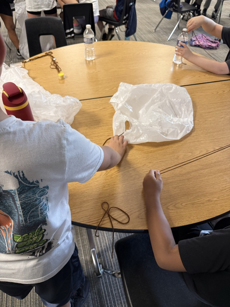 kids building parachutes