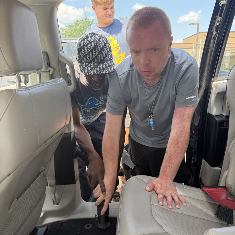 Students vacuum Van 5 at Millet Learning Center