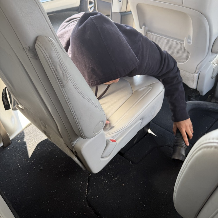 Students vacuum Van 5 at Millet Learning Center