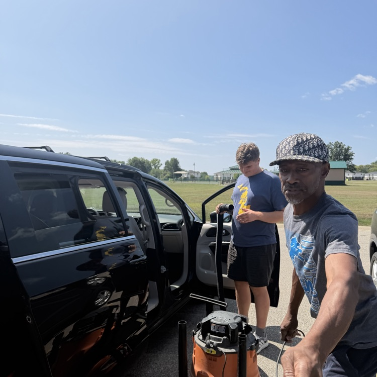 Students vacuum Van 5 at Millet Learning Center