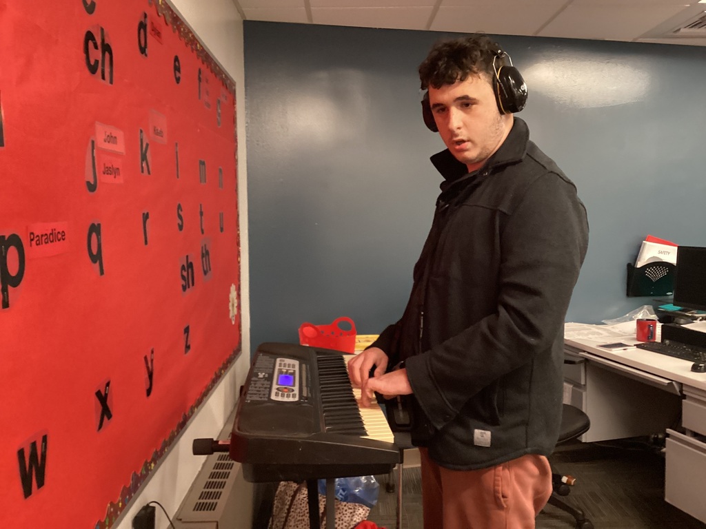 A student enjoys the keyboard 