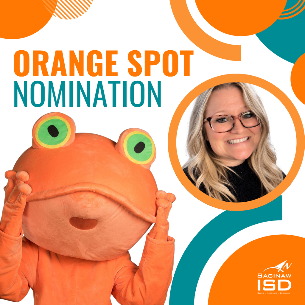 An orange mascot holds up a sign with text "ORANGE SPOT NOMINATION". A woman in glasses smiles on the right.