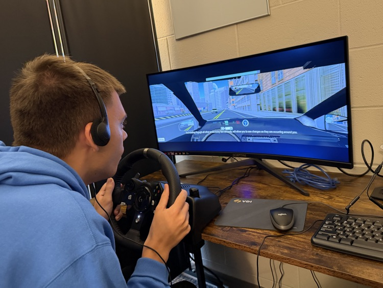 Student using driving simulator
