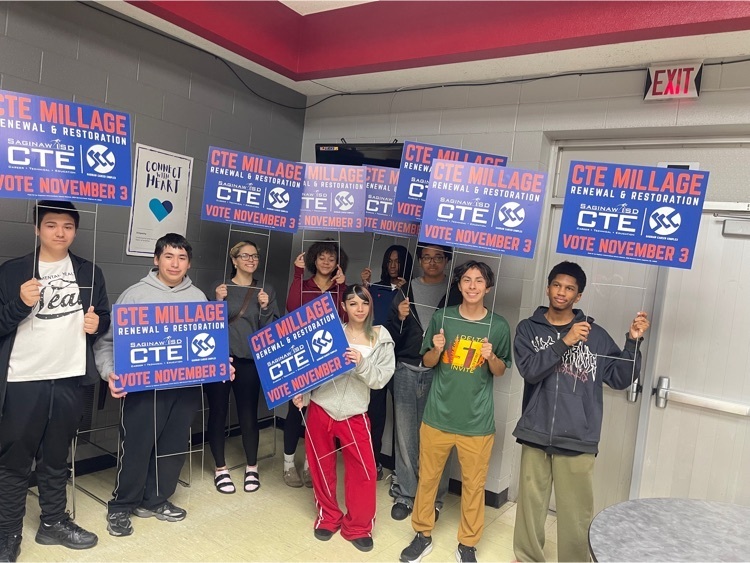 students holding signs