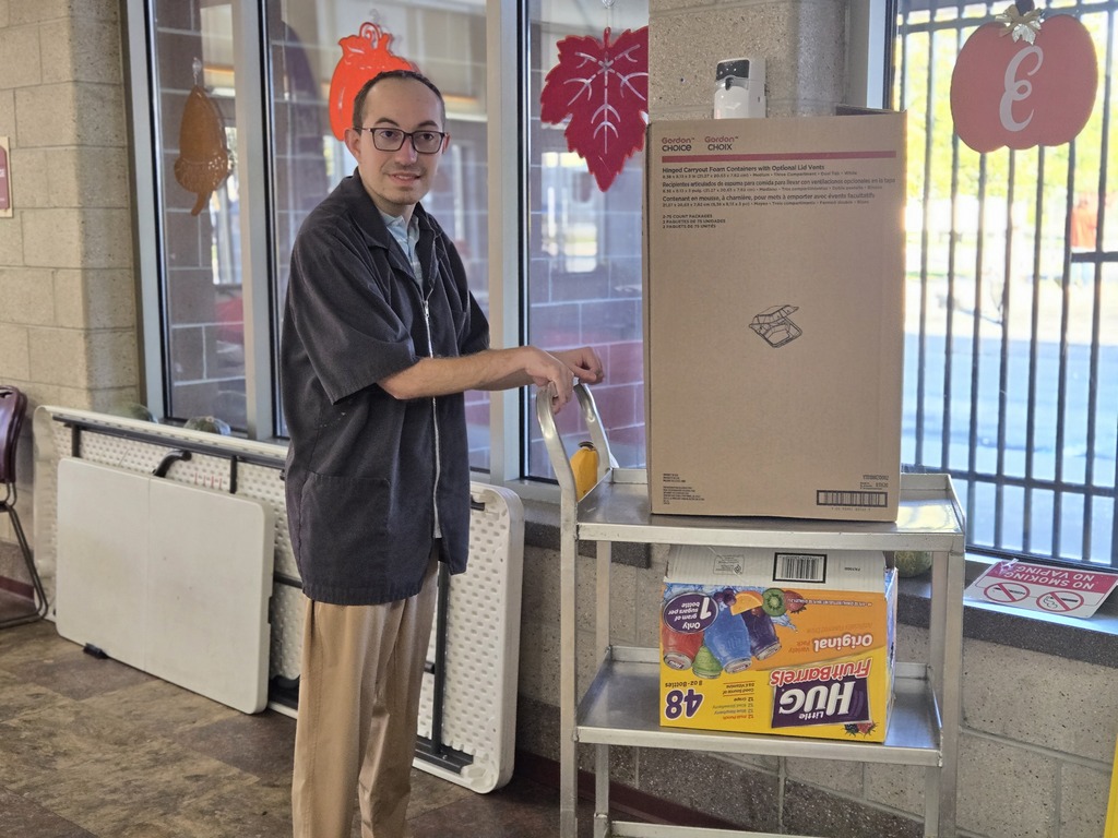 Student pushing a cart