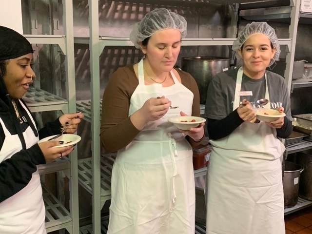 Three students tasting cranberry dishes