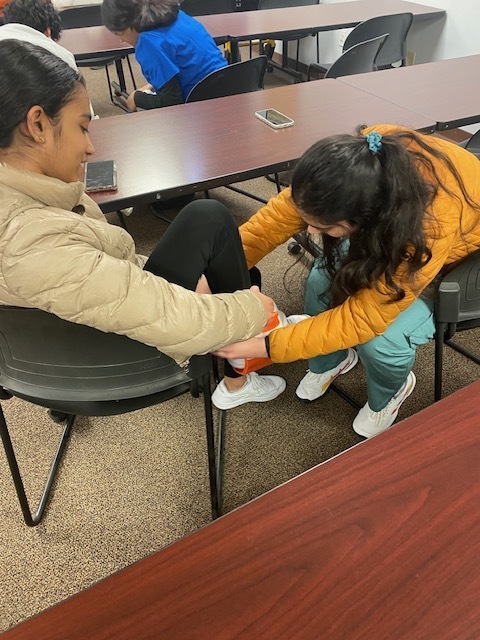 Two students splinting an ankle