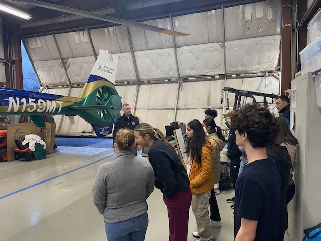 students checking out the helicopter