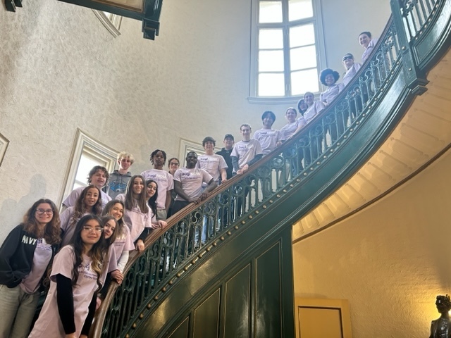 Student ambassadors lined up on the staircase at the Castle Museum