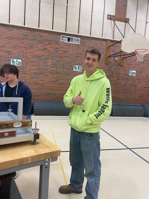 Evan from SCC & Valley Lutheran working the precision and leveling booth