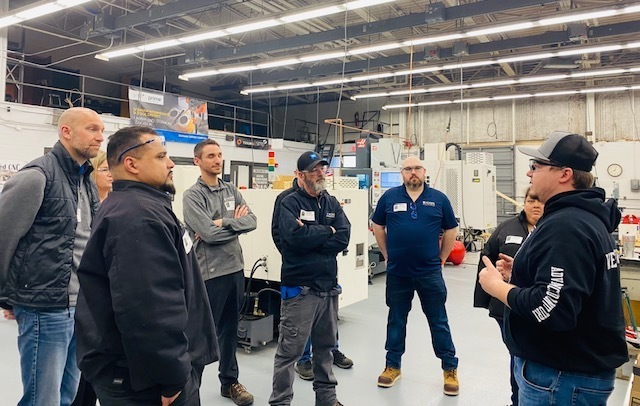 Mr. Wenglikowski talks to the Koops team members about the curriculum and goals for the class