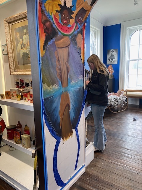 Student looking at artwork