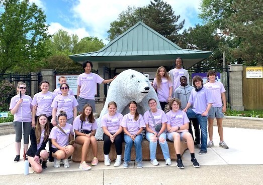 Youth Ambassasdors posting in front of a large white polar bear statue