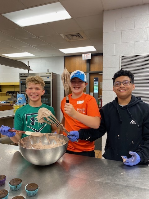Three male campers all smiles as they won the whipping competition