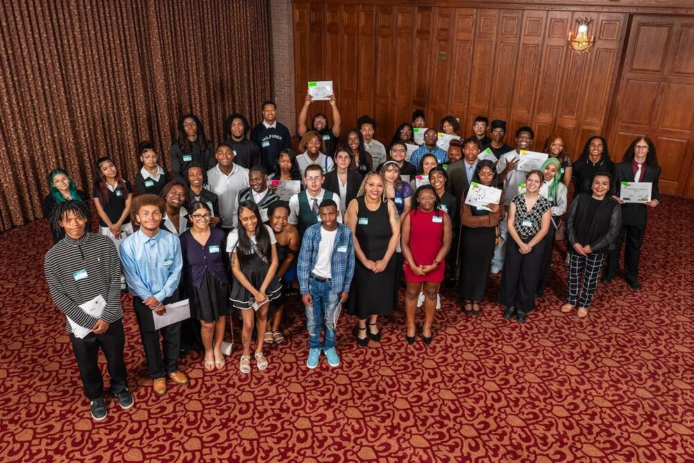 Group photo of Saginaw Promise Scholars with Deborah Sanchez at the Excellence in Education event celebrating scholarship awards.