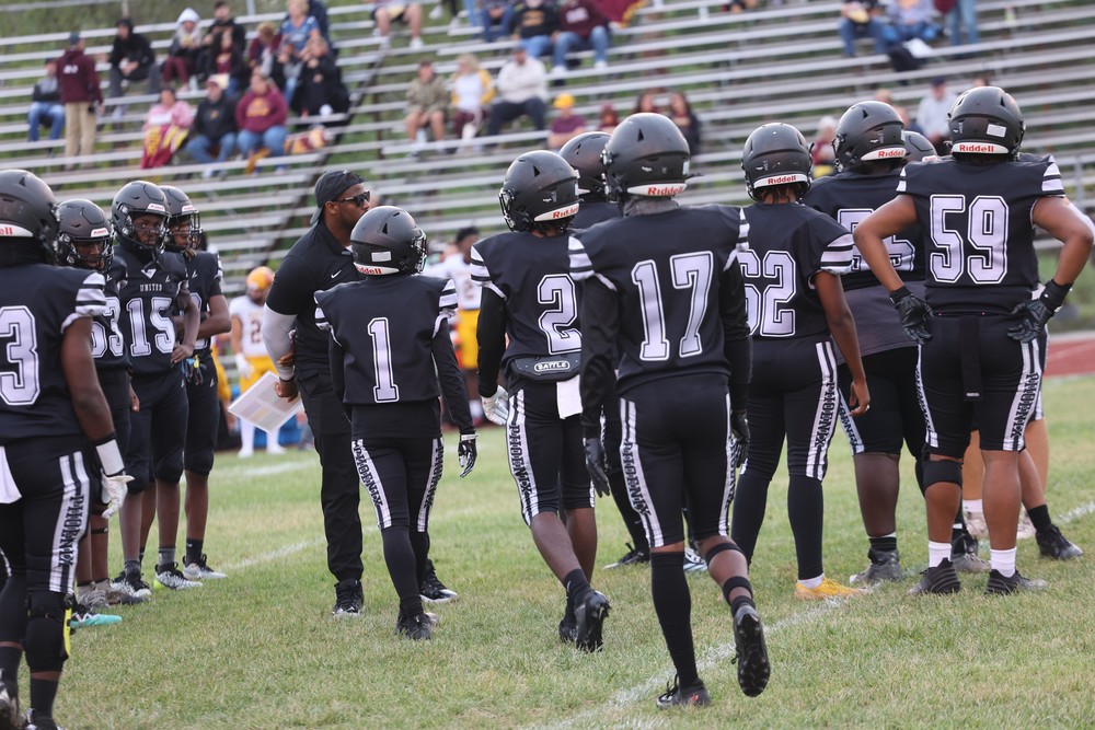 Saginaw United football team on the field