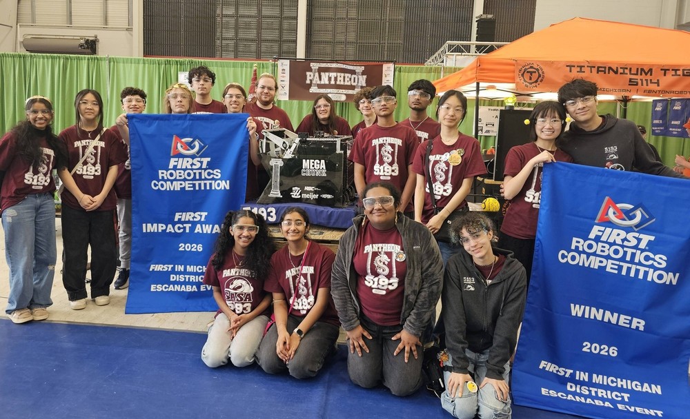 SASA students pose with championship robotis competition banners