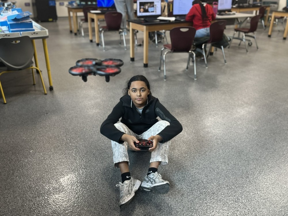 Saginaw Middle School student flying a drone