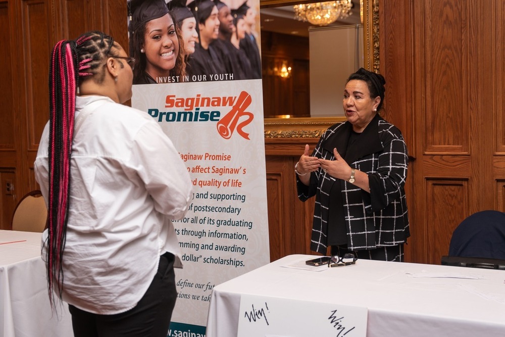 Student discuss scholarship opportunities with advisor