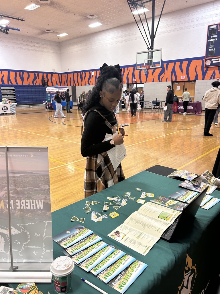 Students meet with a college vendor