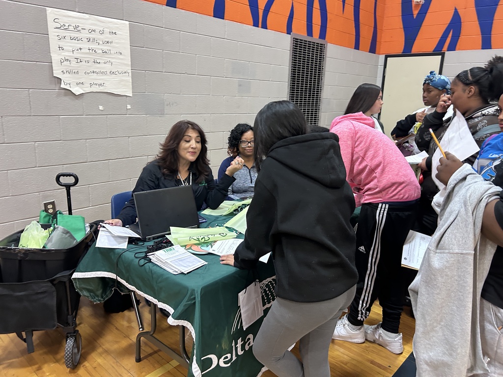 Students meet with a college vendor