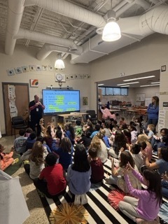 person teaching about scientific method in front of a Cleverboard