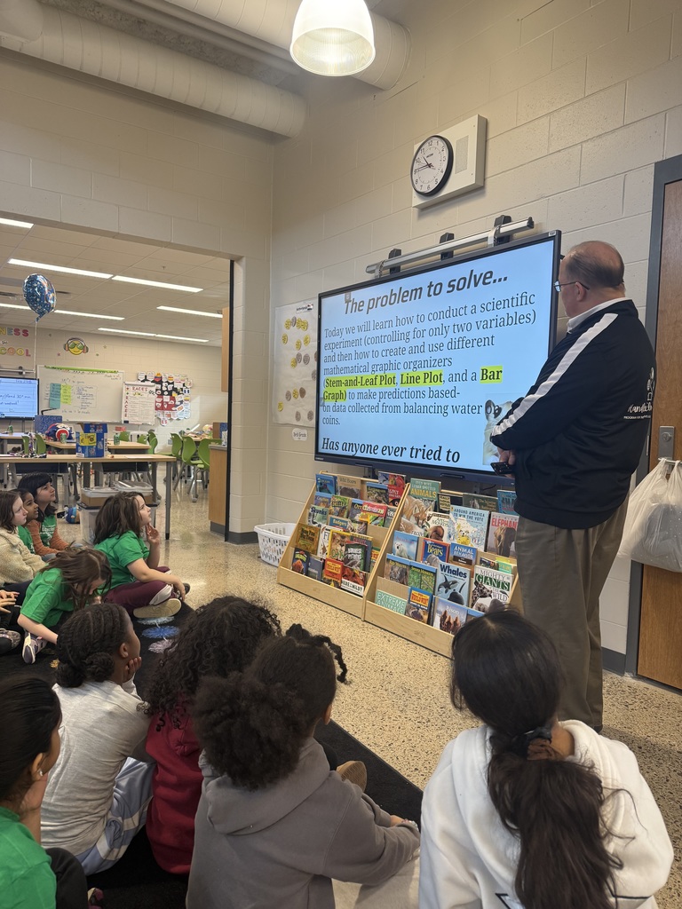 principal presenting presentation in front of students