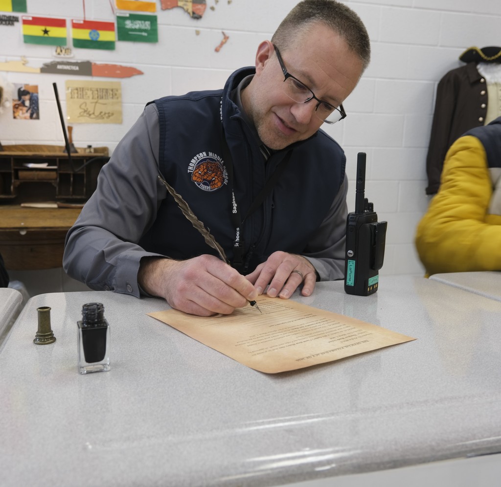 Students celebrate passing their first bill in history class